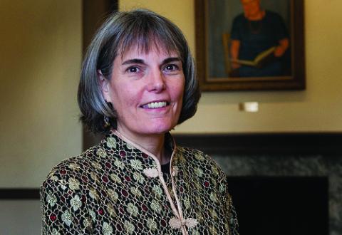 Headshot of Susan McHale with mid-length, grey hair wearing patterned top.