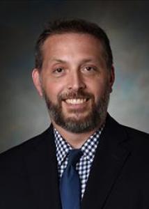 Connell dark hair and beard with jacket and tie