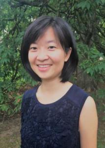 Headshot of Donghui Wang with mid-length, black hair wearing a black tank top.