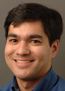 Headshot of Scott Yabiku with short, dark hair wearing a blue-collared shirt.