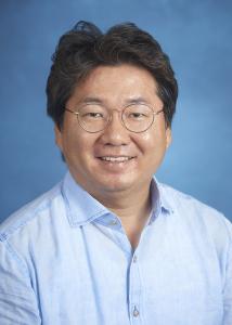 Headshot of Soo-yong Byun with dark hair wearing circular glasses and a light-blue dress shirt.