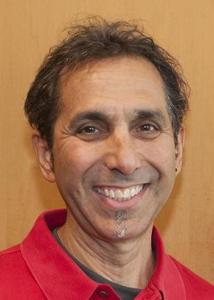 Golden with dark hair and red shirt